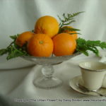 Oranges with teacup